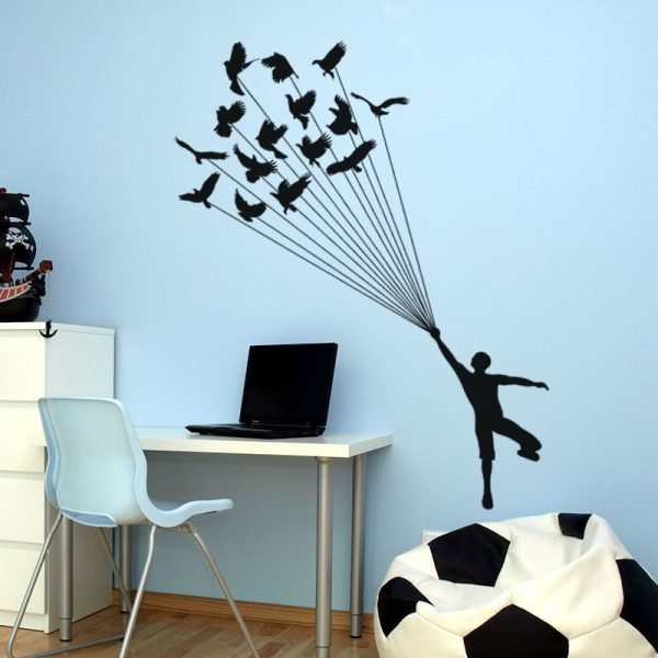 Wall decal Silhouette man with bird parachute